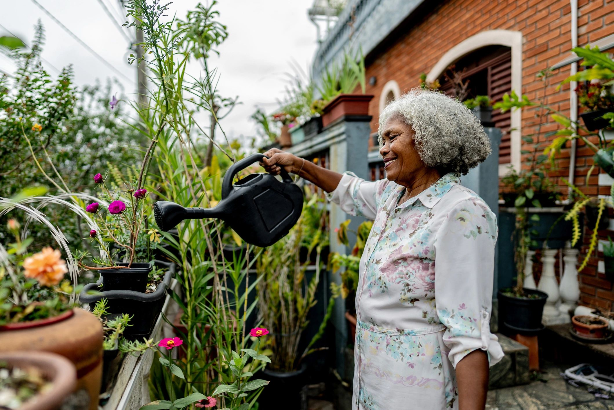 Gardener watering plants